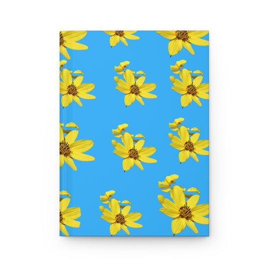 Notebook with yellow flower pattern on a blue background