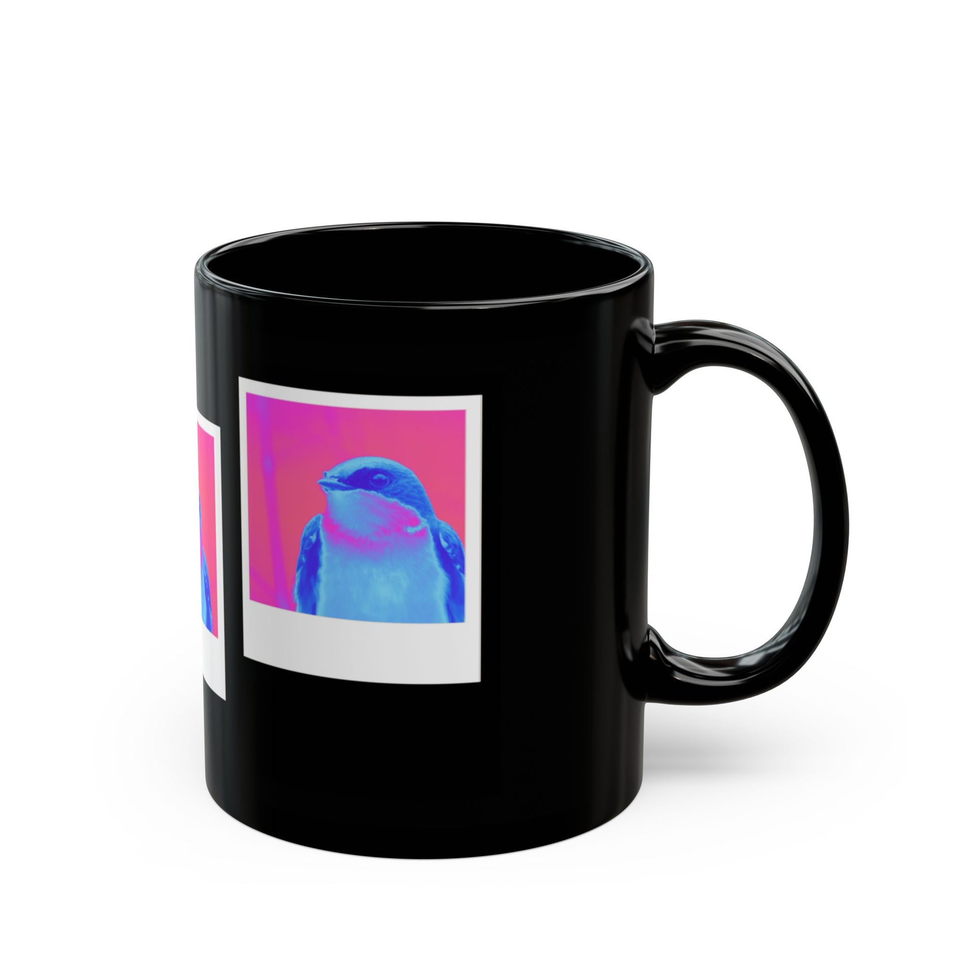 Black mug with a colorful bird design on a white background