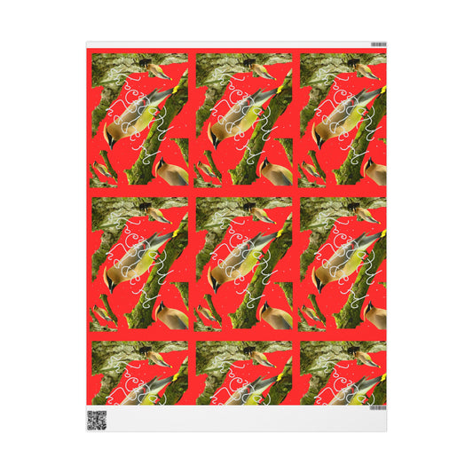 Wrapping paper with a red background featuring cedar waxings on branches with the words happy holidays in white and white speckling representing snow throughout. 