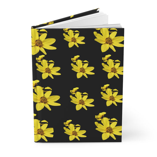 Notebook with yellow flower pattern on a black background