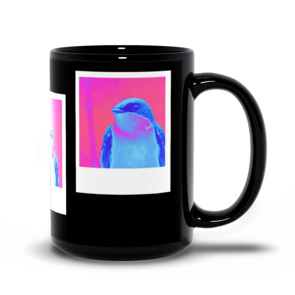 Black mug with a colorful tree swallow design on a white background