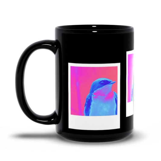 Black mug with a colorful bird design on a white background