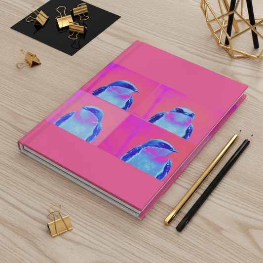 Blue bird journal on light wood desk