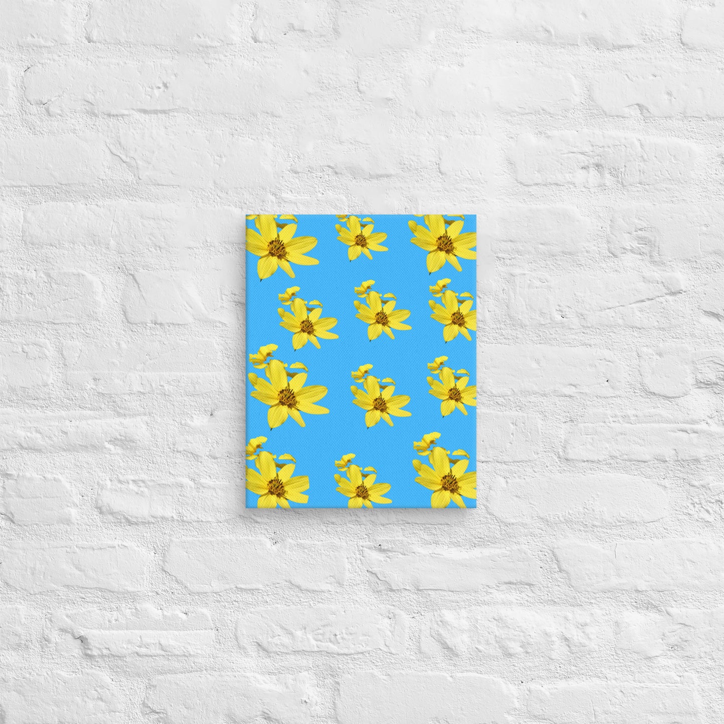 Canvas with yellow flower pattern on a blue cover against a textured white wall background
