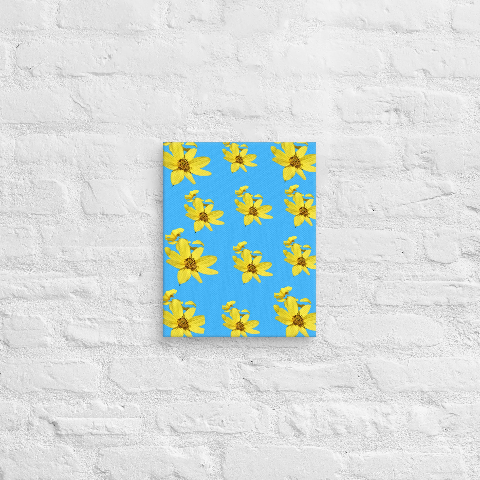 Canvas with yellow flower pattern on a blue cover against a textured white wall background