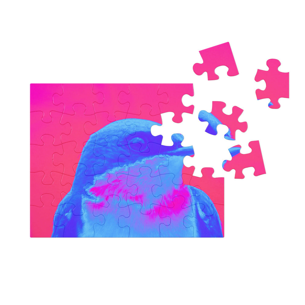 Jigsaw puzzle with a blue and pink bird design on a white background