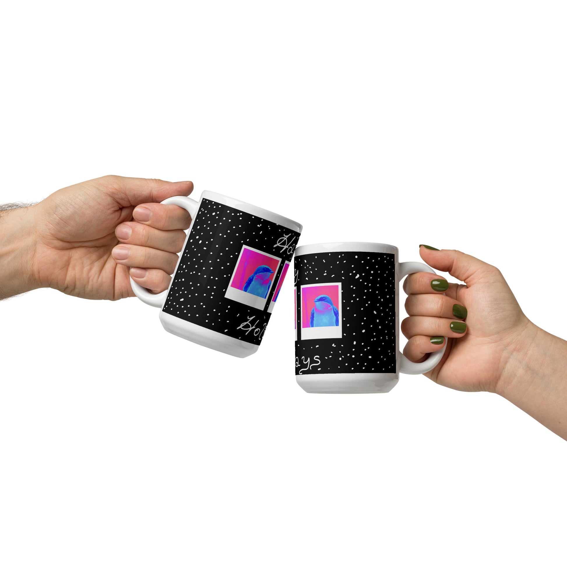 Two hands holding mugs with a design of a pink and blue abstract shape on a black background with white dots.