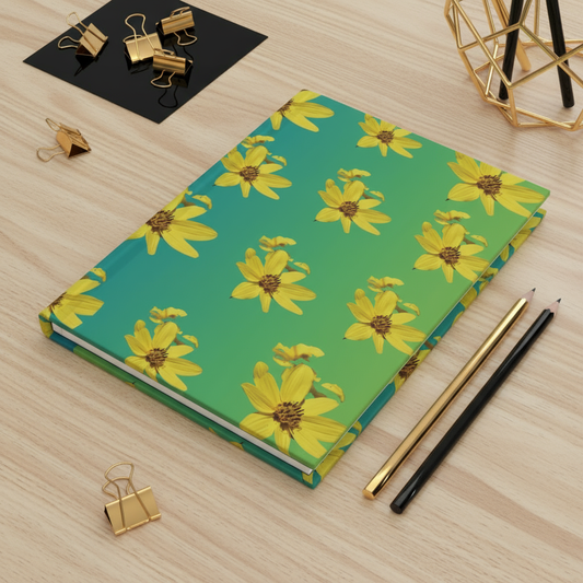 Yellow flowers journal on light wood desk